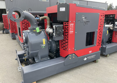Red enclosed diesel driven pump package sitting outside